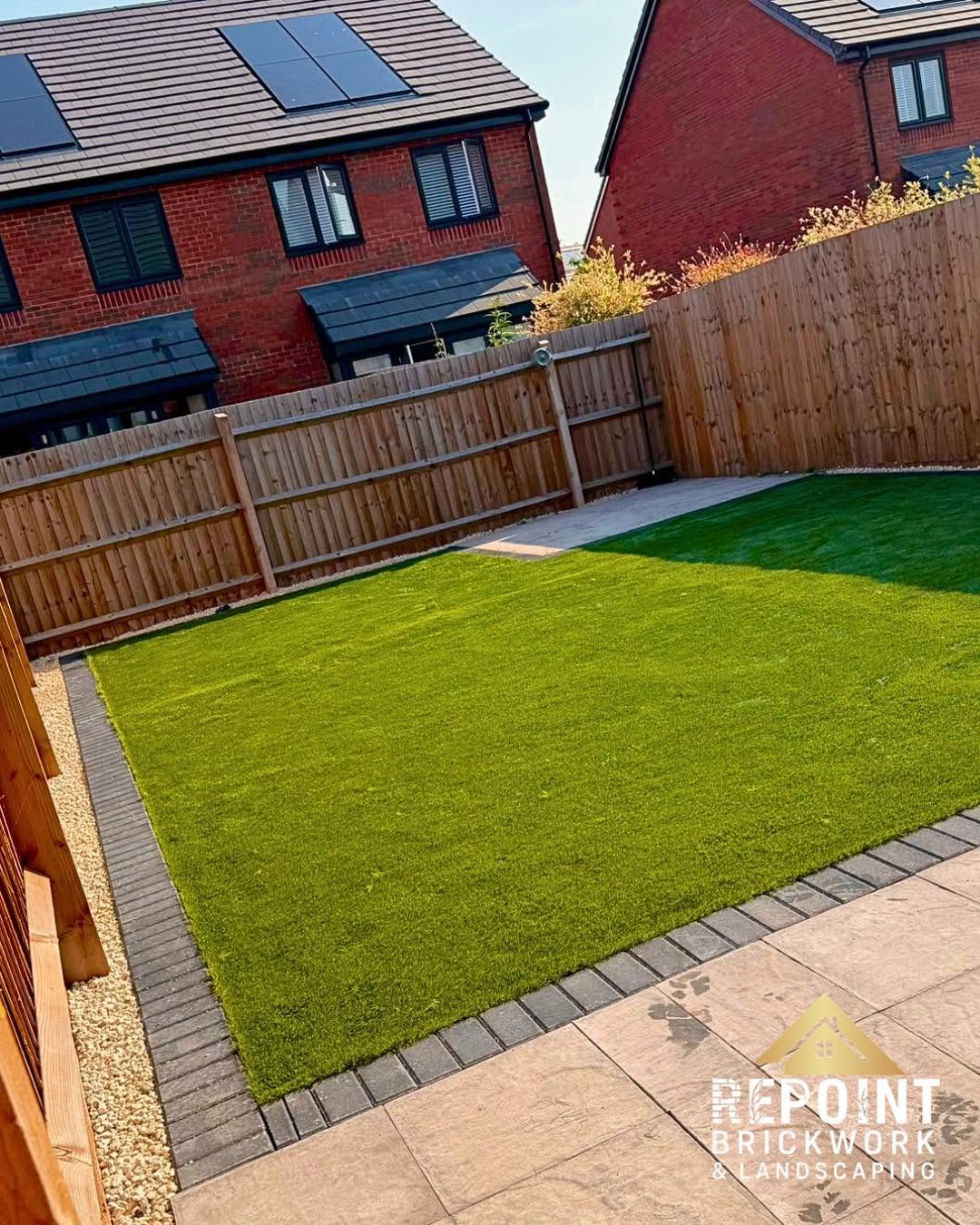 Artificial grass lawn with block paving edge