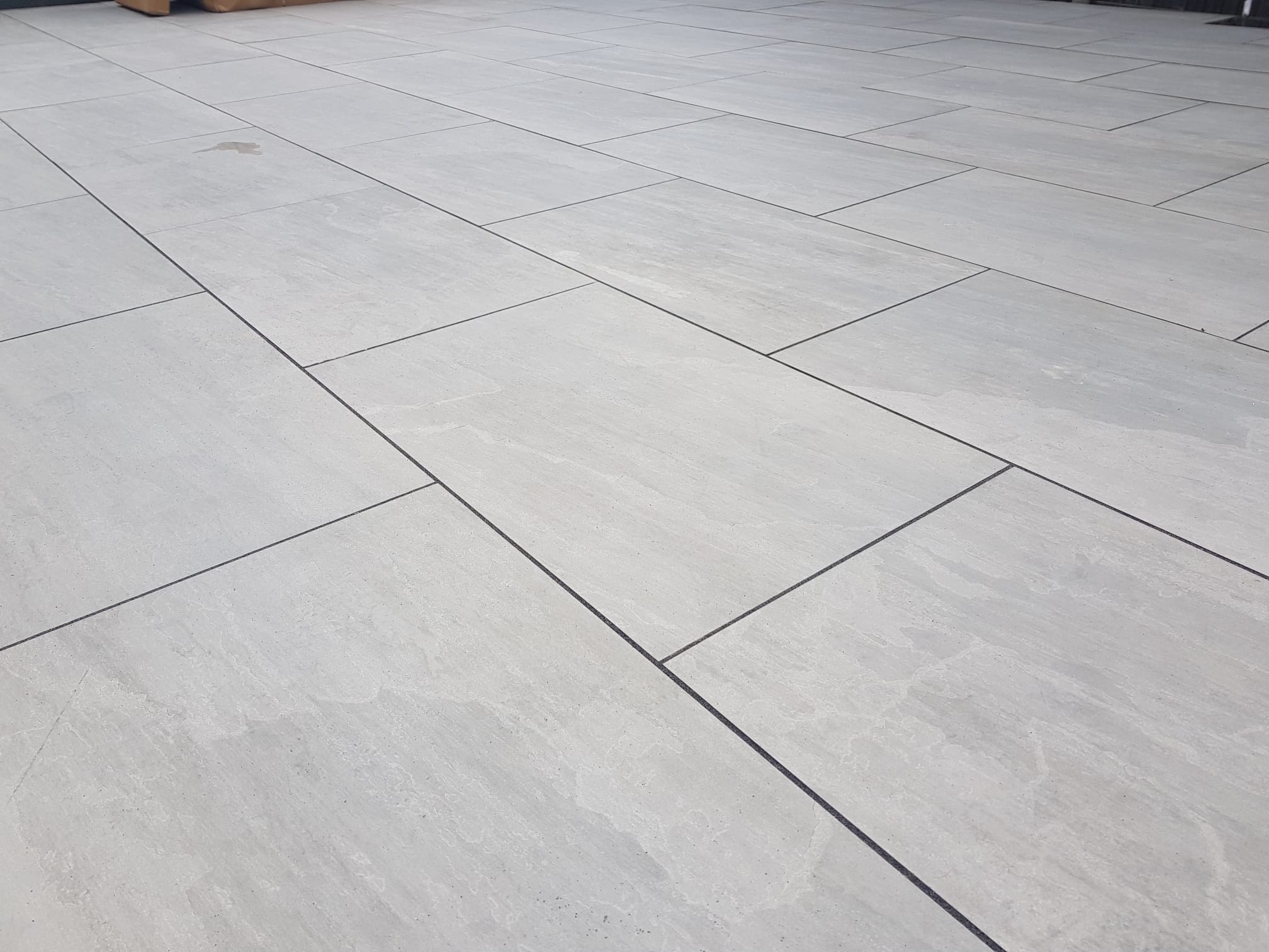 Large-format grey porcelain patio
