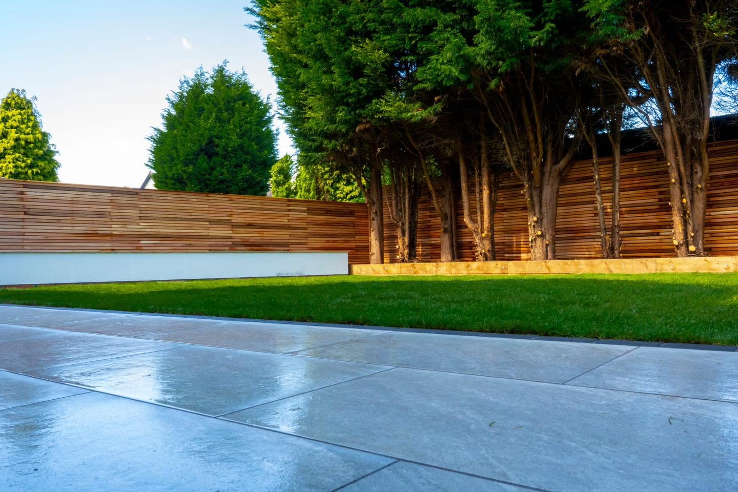 Large-format porcelain patio with cedar fencing