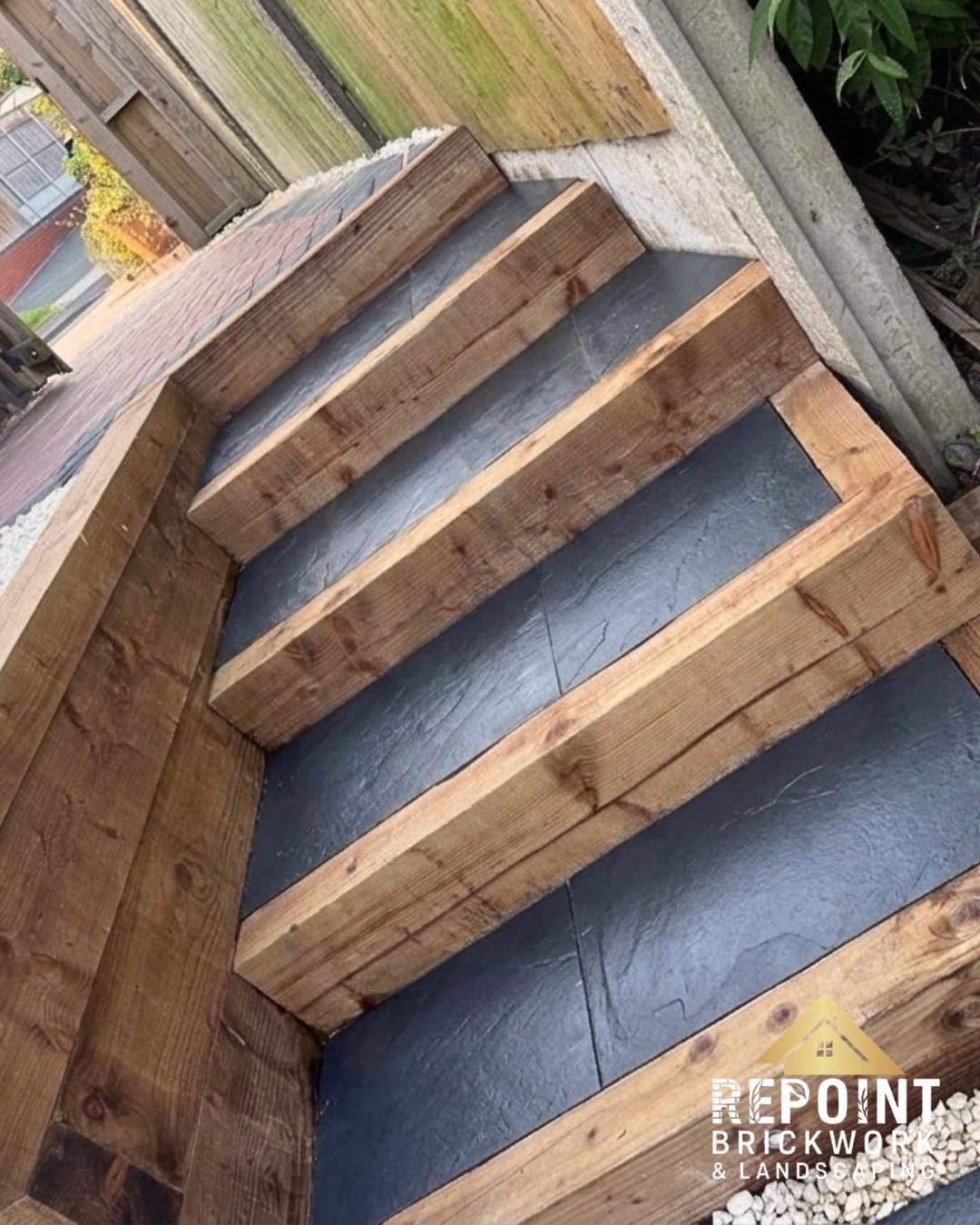 Timber-edged garden steps with slate treads